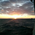 Sun sets over the L'Atalante in the Tasman Sea