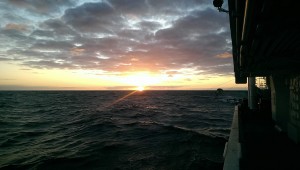 Sun sets over the L'Atalante in the Tasman Sea